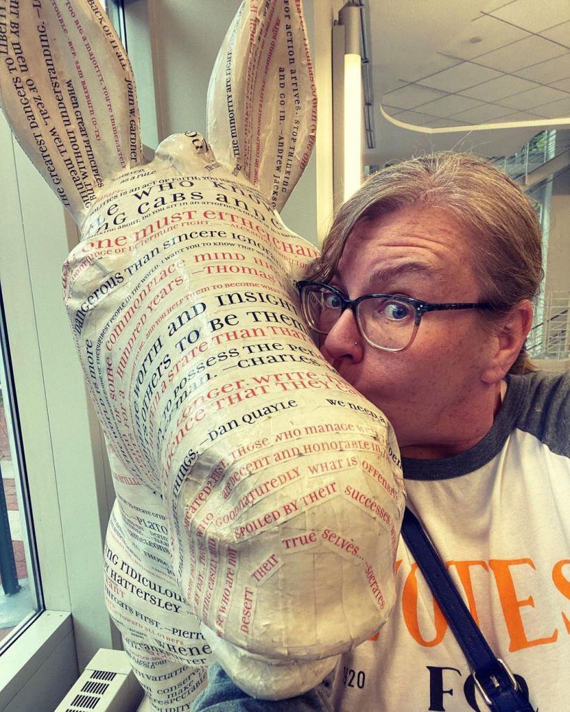 Dr. MT Hallock Morris with the Democratic Donkey statue on the campus of George Washington University. 